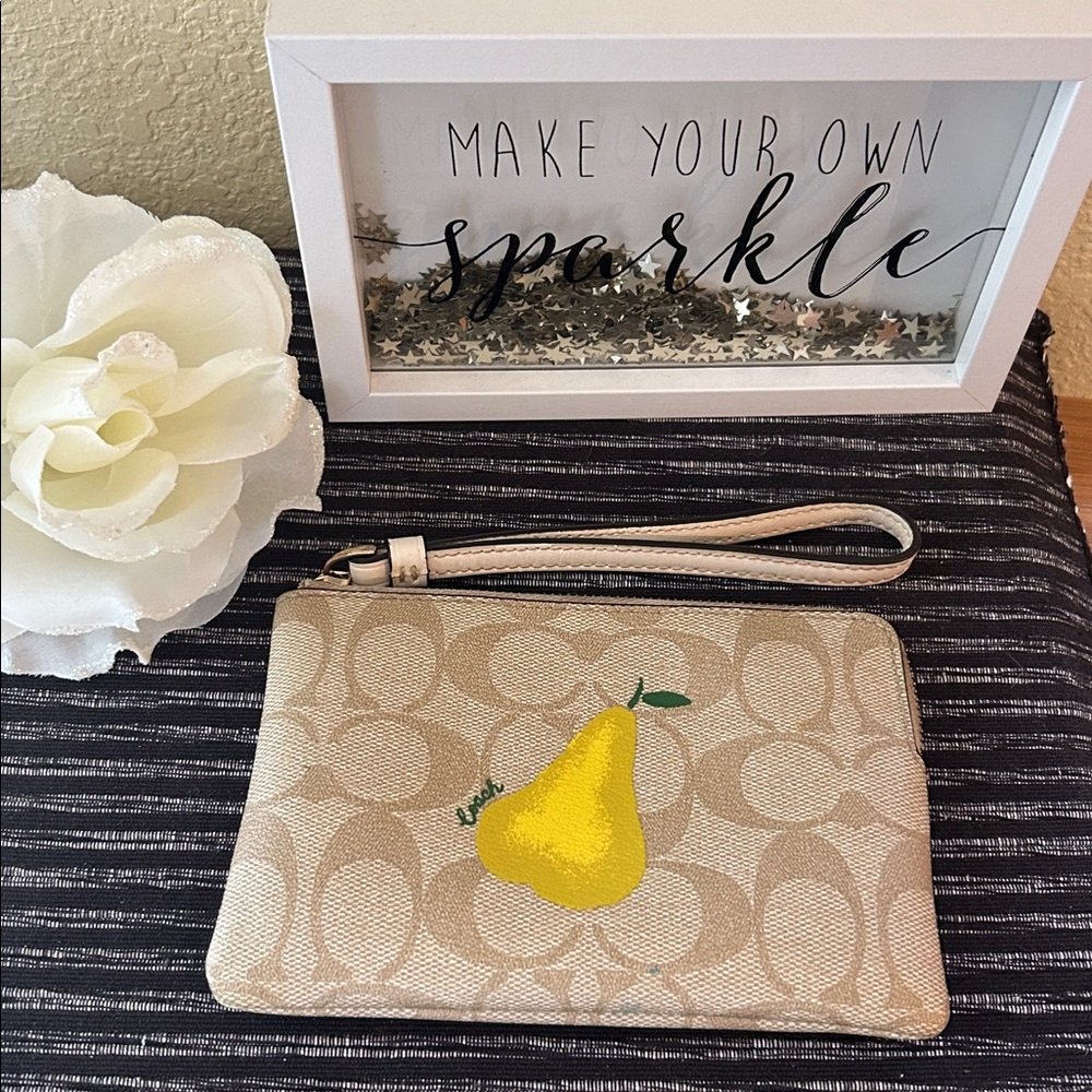 Coach Corner zip wristlet yellow pear print signature canvas.